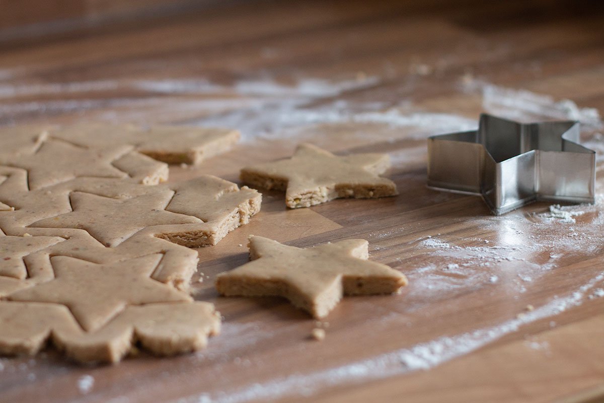 Spiced biscuit dough cut into star shapes