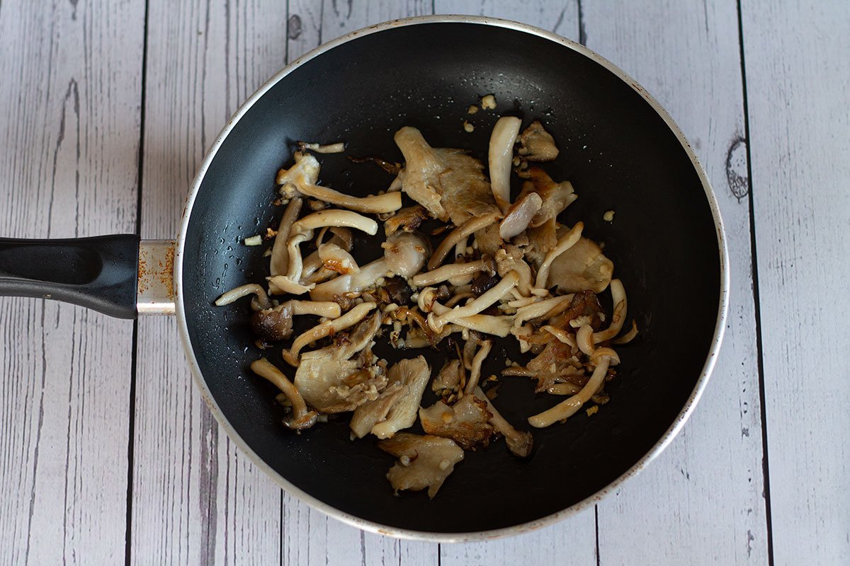 browned garlic mushrooms in frying pan