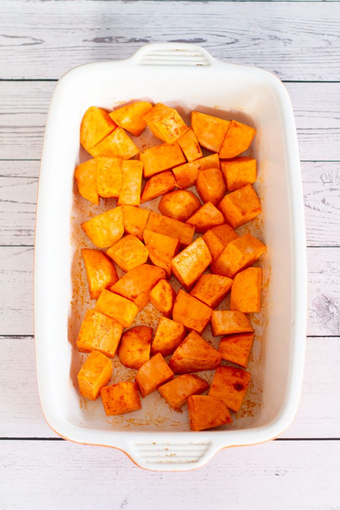 chopped sweet potato in a roasting dish