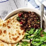 lamb mince, flatbread and salad in a bowl