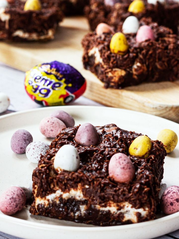 Easter brownies on a wooden board with Cadbury Mini Eggs.
