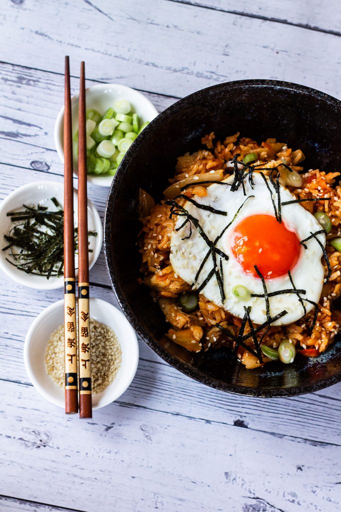 Plated chicken kimchi fried rice with toppings