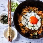 chicken kimchi fried rice served with toppings