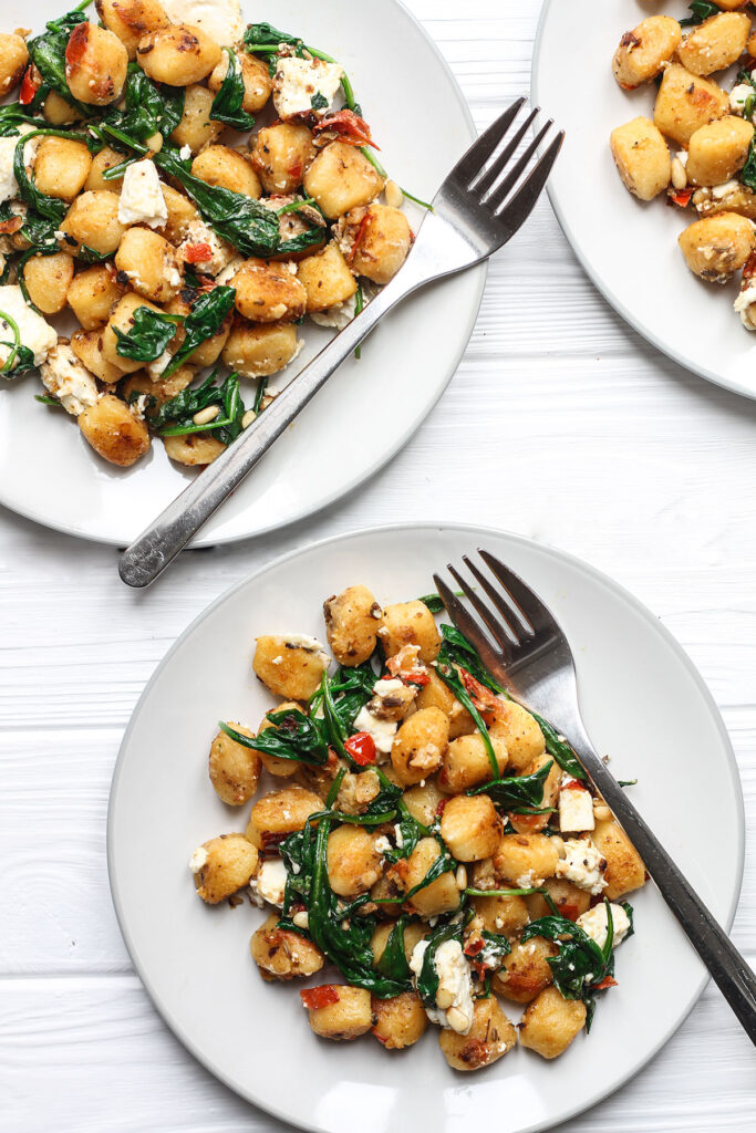 Serving of Fried Gnocchi With Feta, Spinach and Pine Nuts