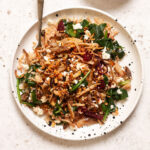 warm mushroom salad on a plate topped with crunchy onions