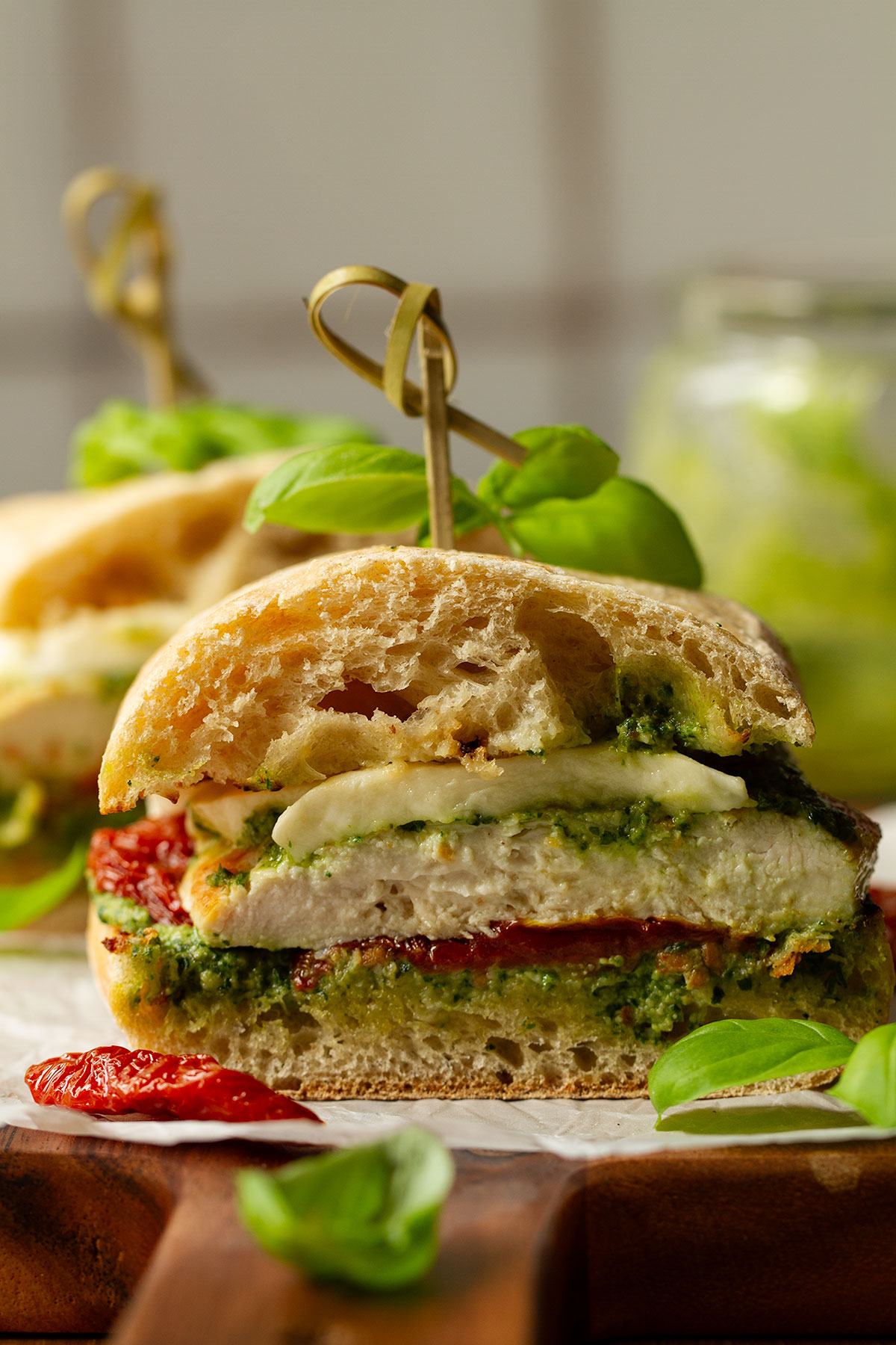 A cross section photograph of a serving of a chicken ciabatta sandwich.