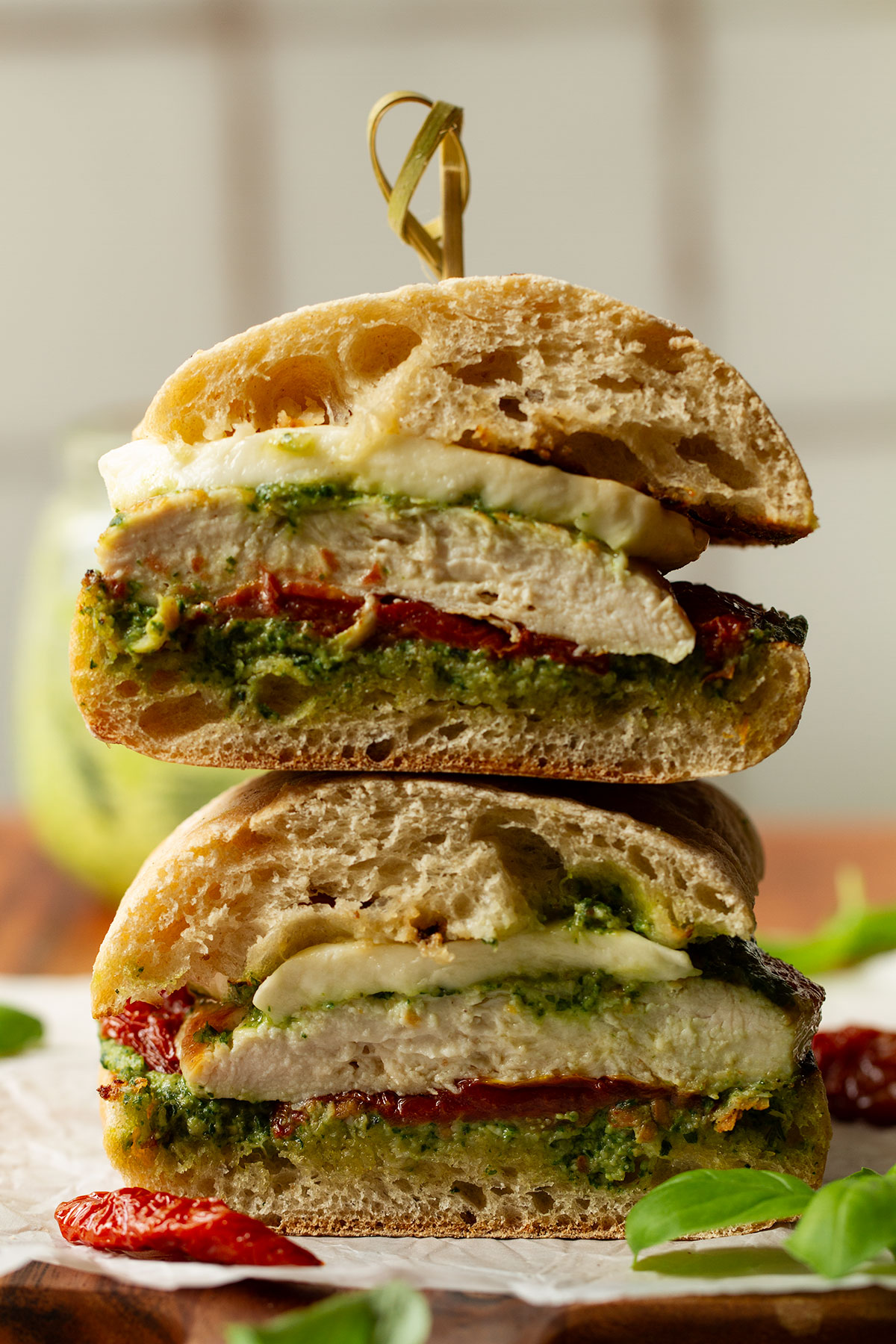 A cross section photograph of a serving of two chicken ciabatta sandwiches.