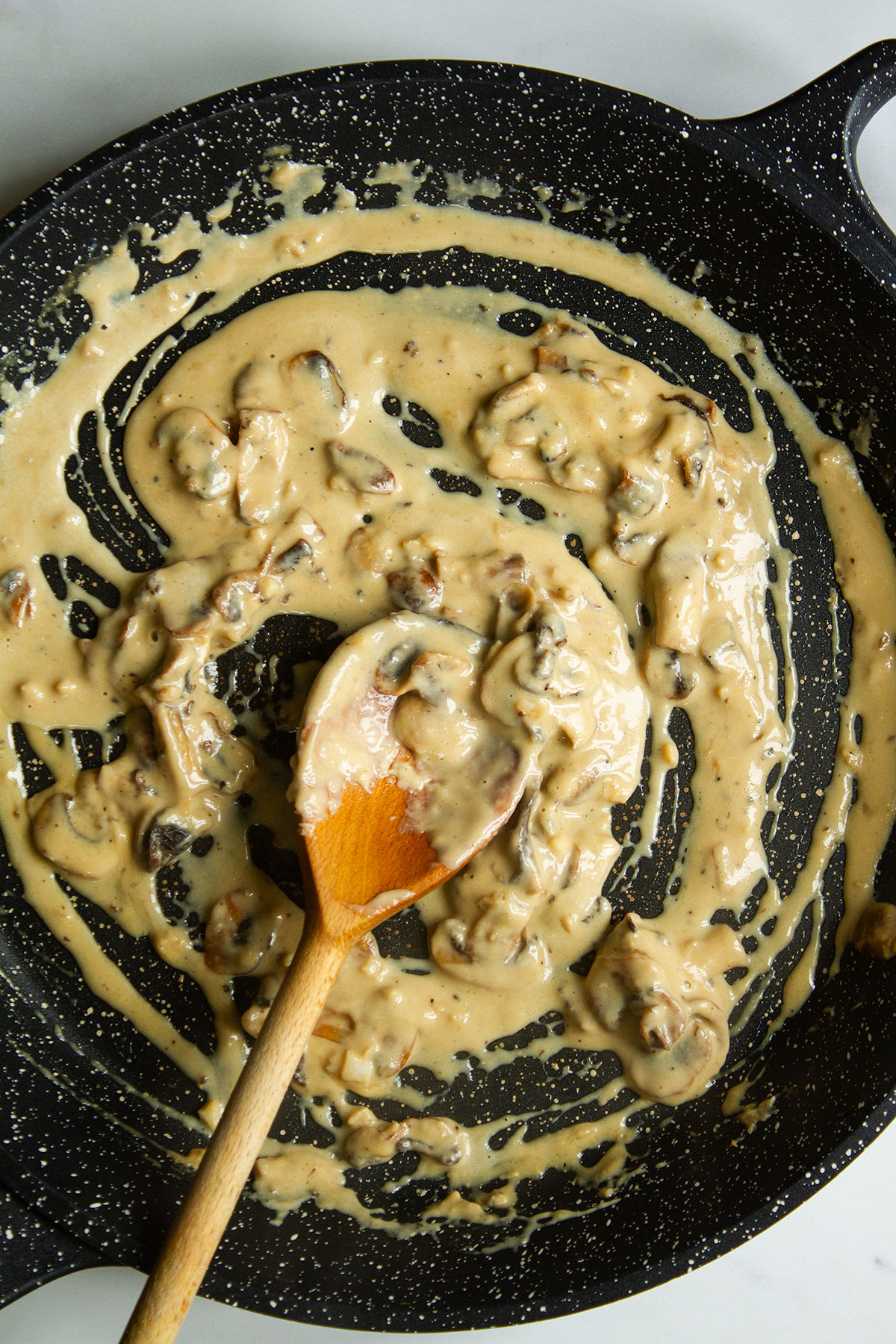 Creamy mushroom miso pasta sauce in a skillet.
