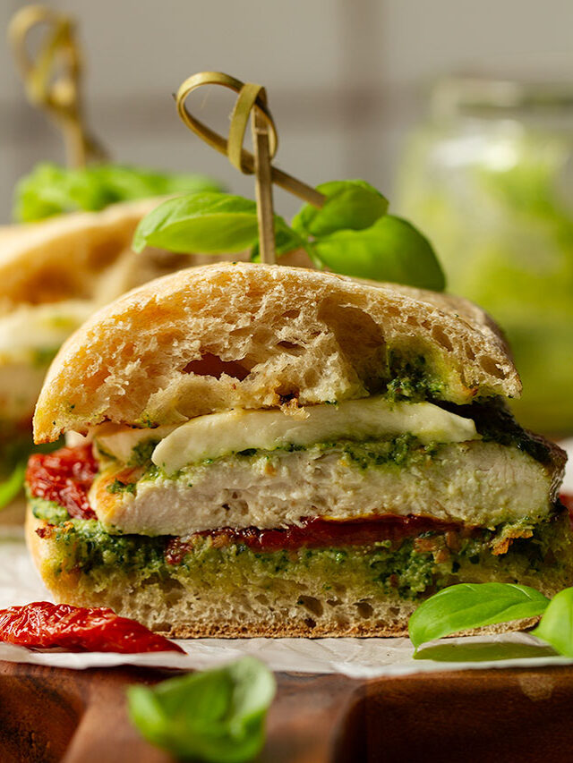 A cross section photograph of a serving of a chicken ciabatta sandwich.