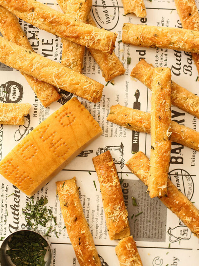 cheese straws on newspaper backgroudn