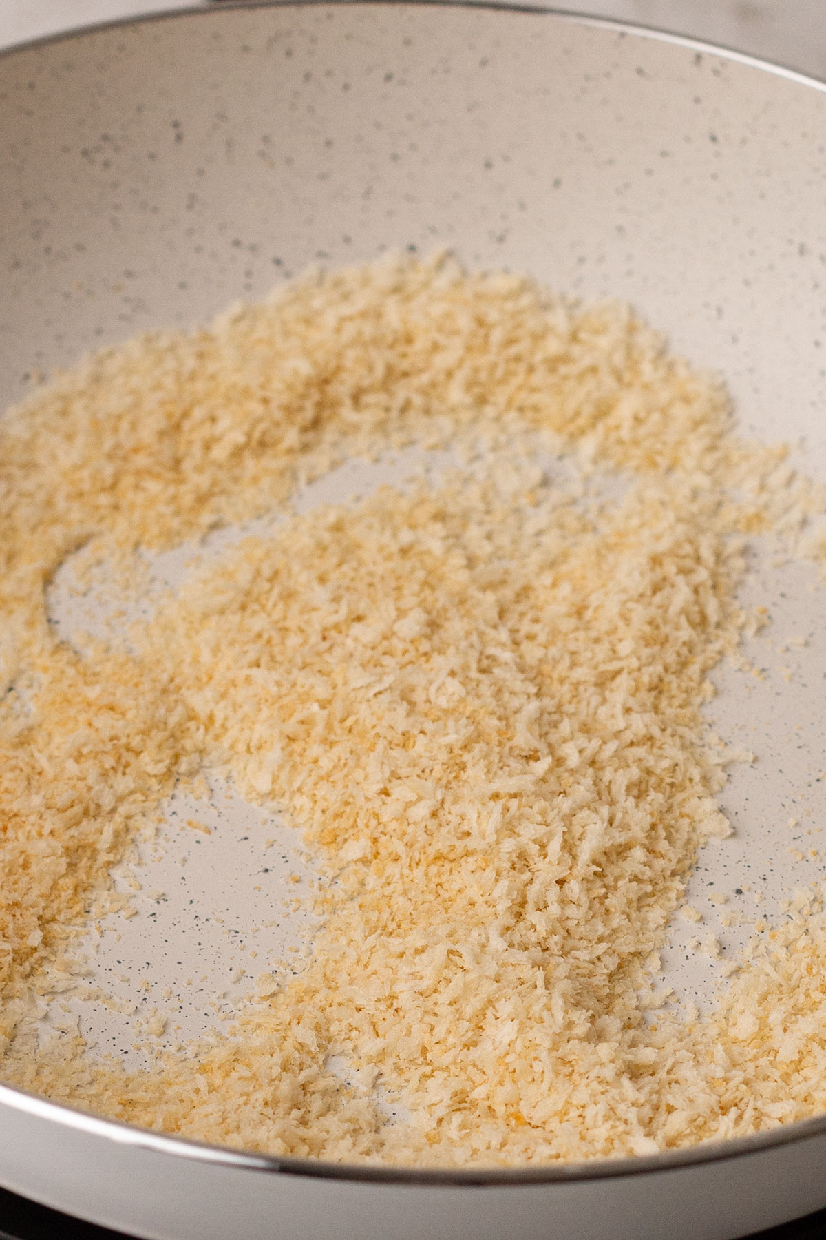 The panko breadcrumbs in a skillet ready for toasting,