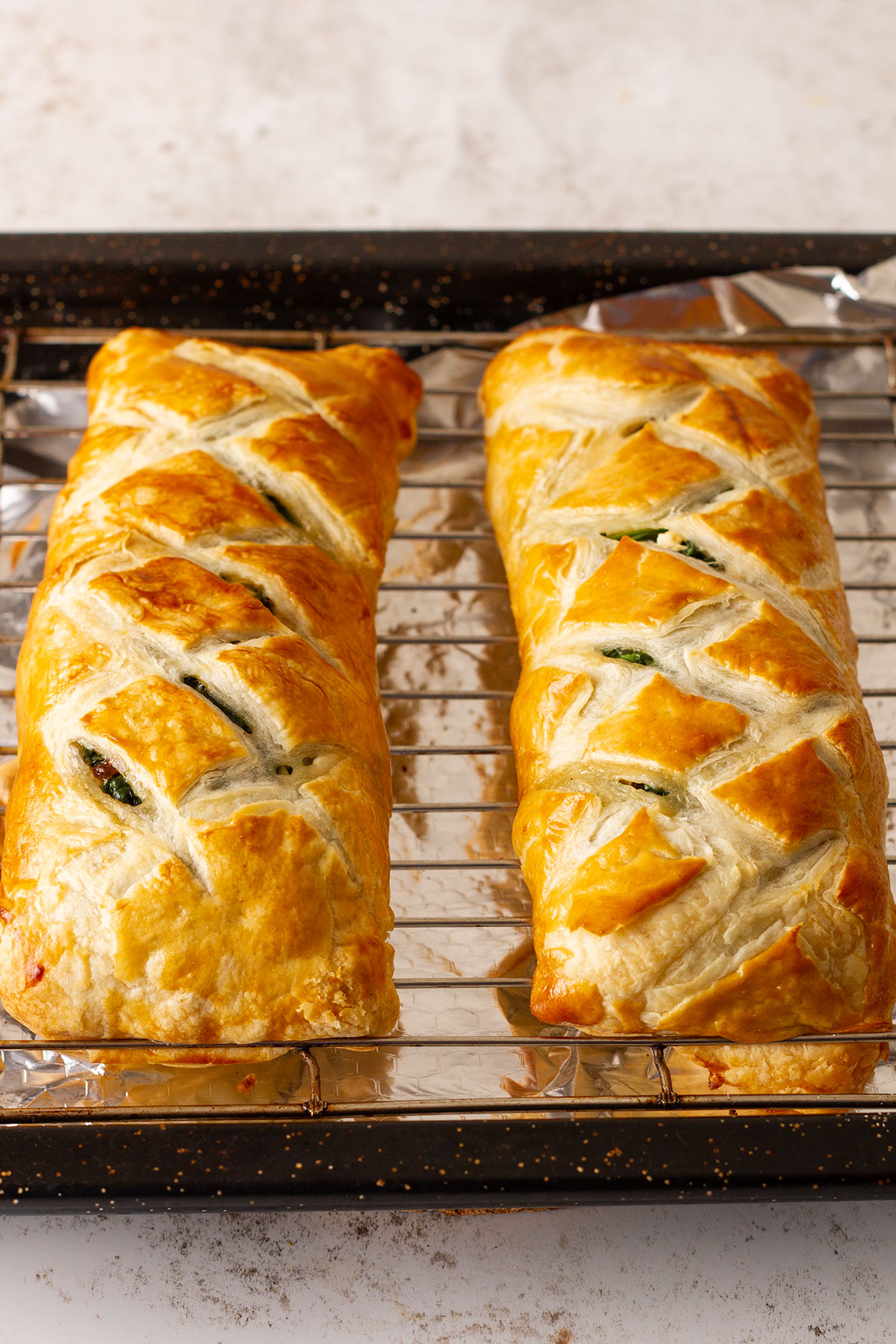 Two baked salmon wellingtons ready for serving.