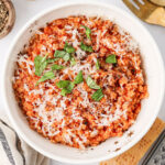 A serving of Tomato Pastina in a white bowl.